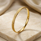 Gold-Tone Matte Finish Round Bangle Bracelet for Women, Minimalist Closed Metal Jewelry with Brushed Texture, Elegant Slim Wrist Accessory for Everyday Wear