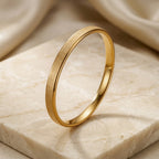 Gold-Tone Matte Finish Round Bangle Bracelet for Women, Minimalist Closed Stainless Steel Jewelry with Brushed Texture, Elegant Slim Wrist Accessory for Everyday Wear