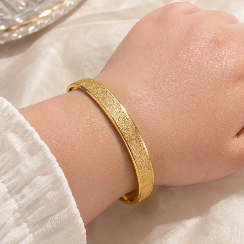 Gold-Tone Matte Finish Round Bangle Bracelet for Women, Minimalist Closed Stainless Steel Jewelry with Brushed Texture, Elegant Slim Wrist Accessory for Everyday Wear